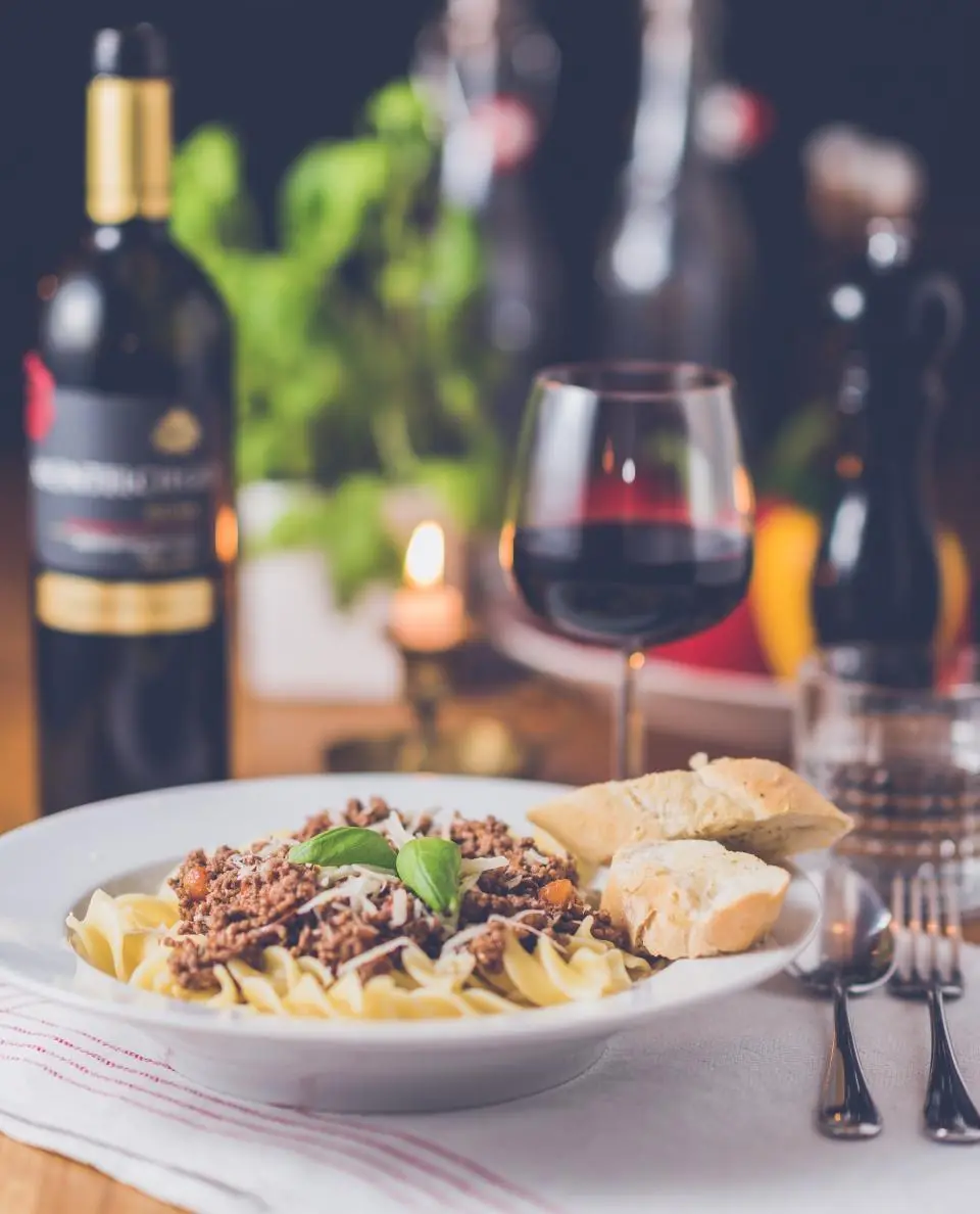 Pasta and red wine by candlelight